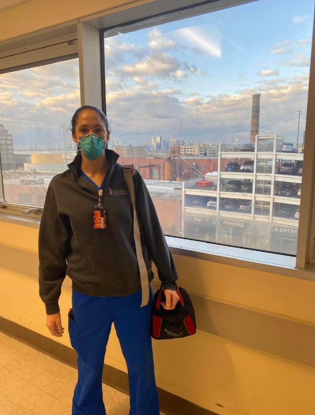 travel nurse poses in front of new york city skyline
