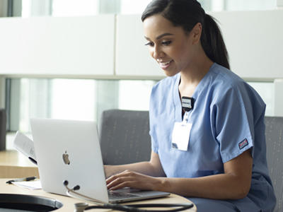 Nurse working on a laptop