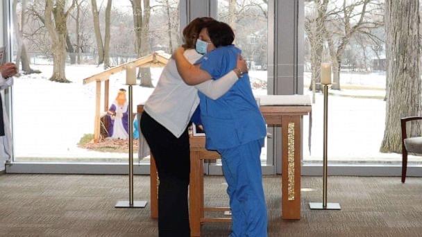 Chamberlain nurse hugging