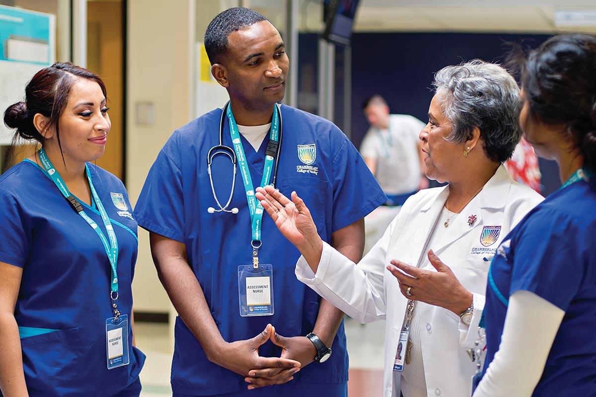 Nursing mentor explaining to nurses in training