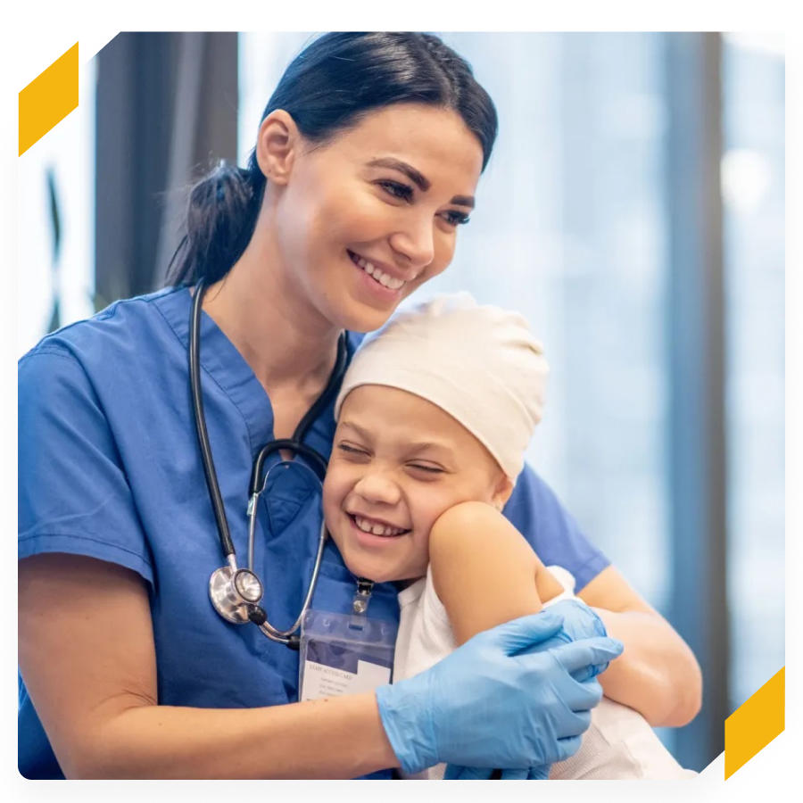 Smiling nurse holding a smiling child